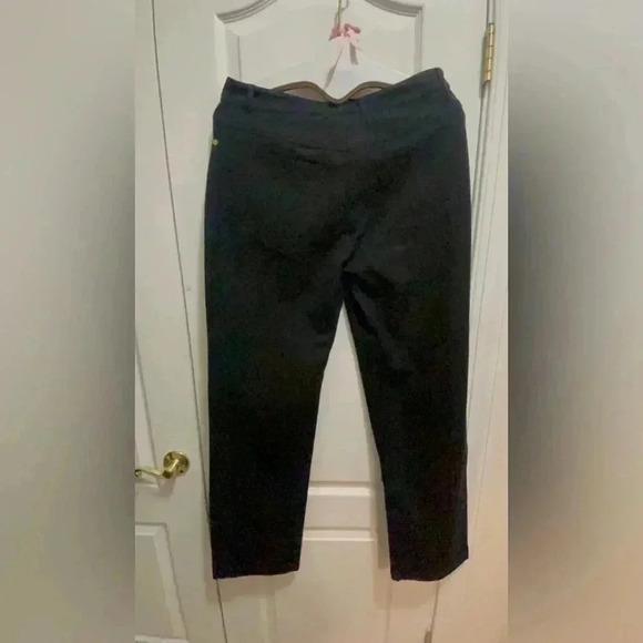 St. John black jeans in new condition . Gorgeous hardware around the belts . - Picture 1 of 14